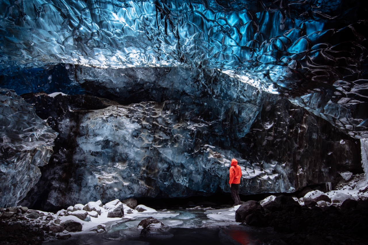 Man standing in the ice cave in Iceland