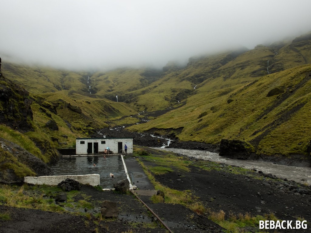 people bathing in the Seljavallalaug Swimming Pool in Iceland