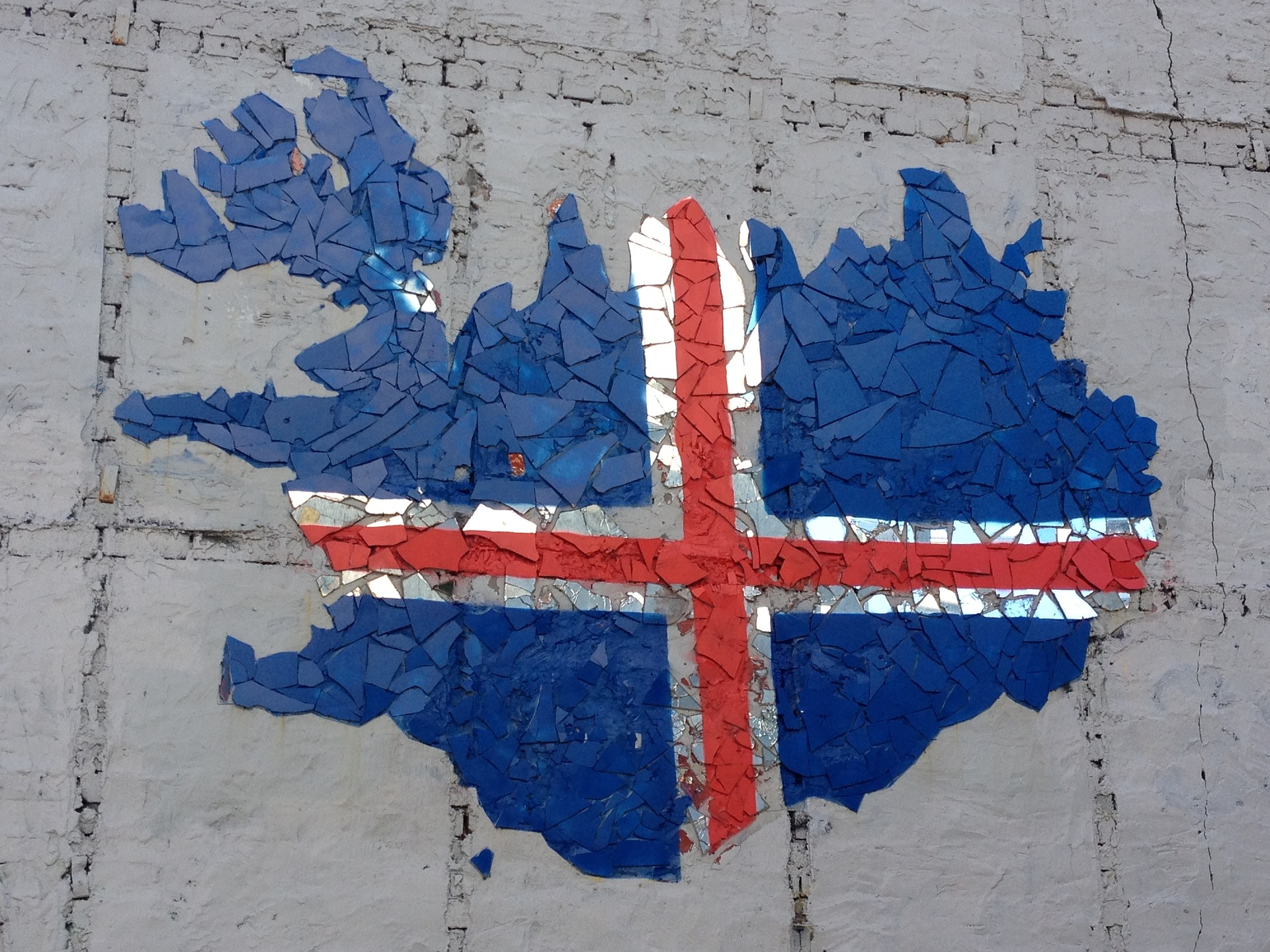 street art representing the icelandic flag on a wall in Reykjavik Iceland