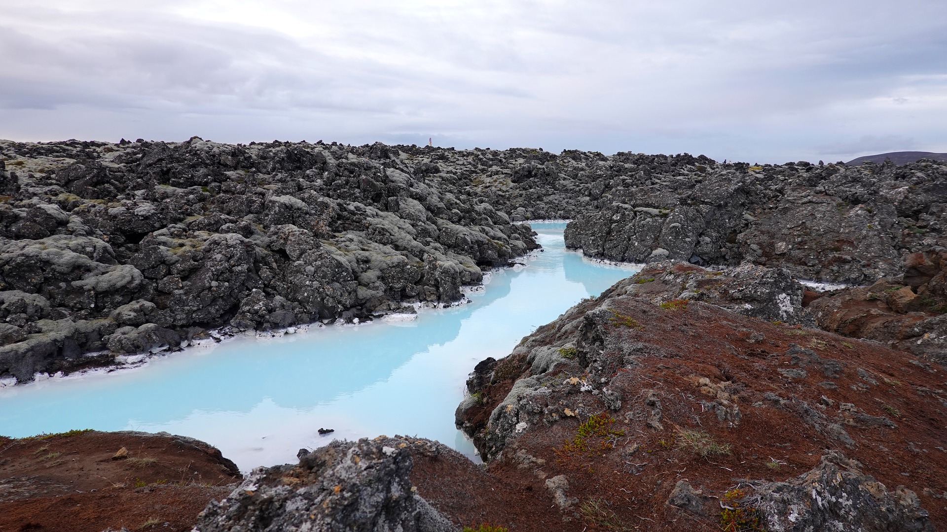 blue lagoon iceland, milky blue water and rocks